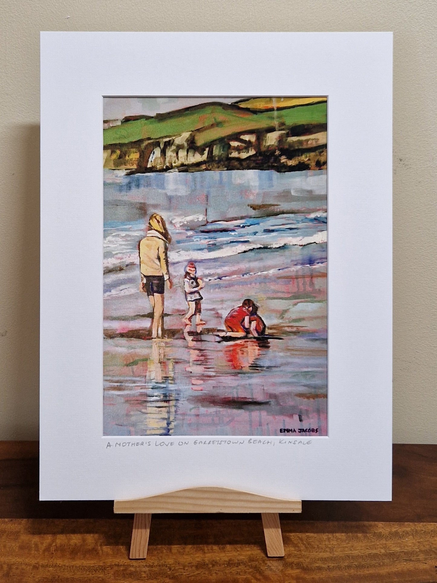 Mounted fine art print of a mother and child on the beach, figurative work by Irish artist Emma Jacobs