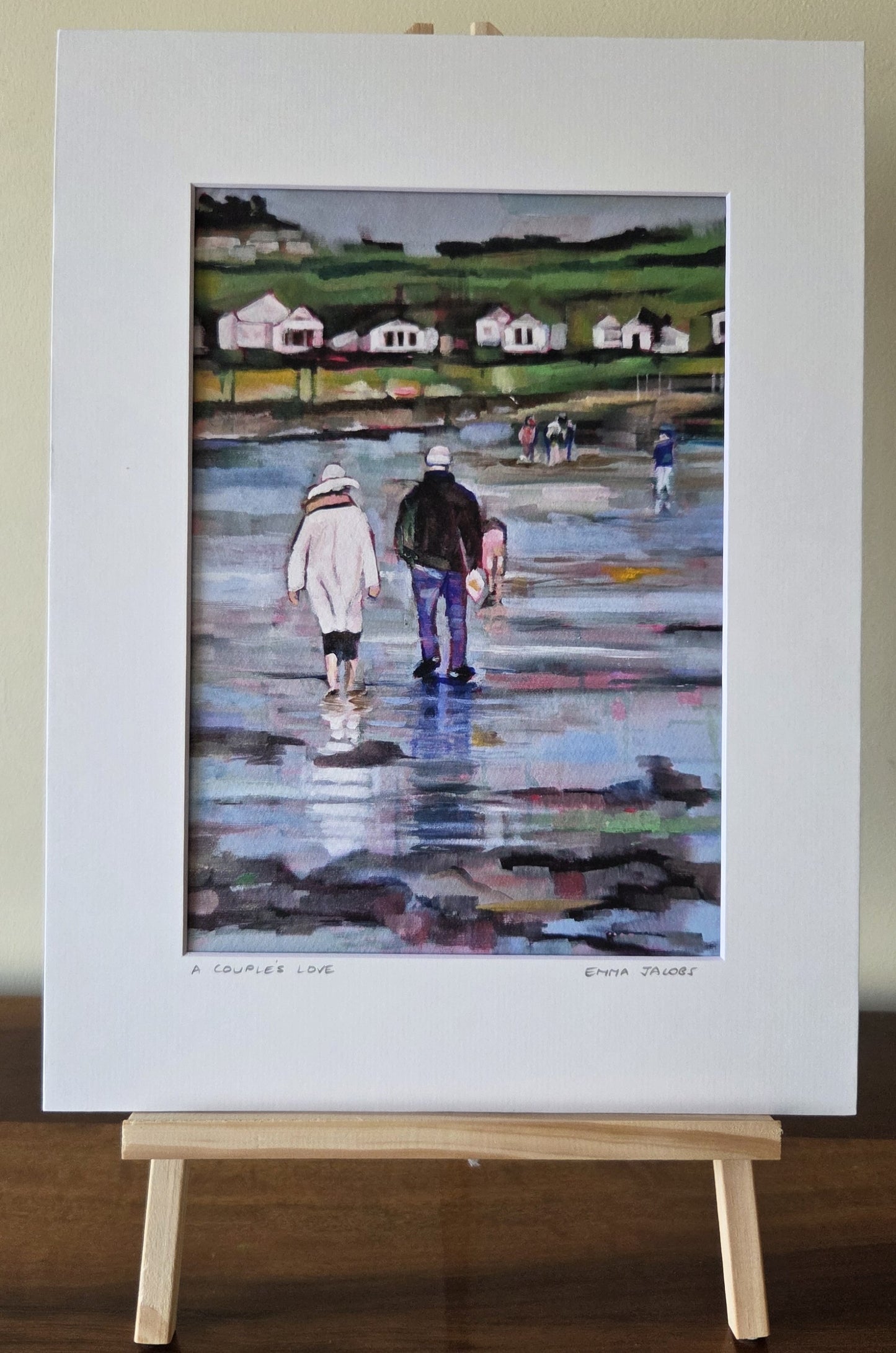 Mounted fine art print of a couple walking on the beach, by Irish artist Emma Jacobs