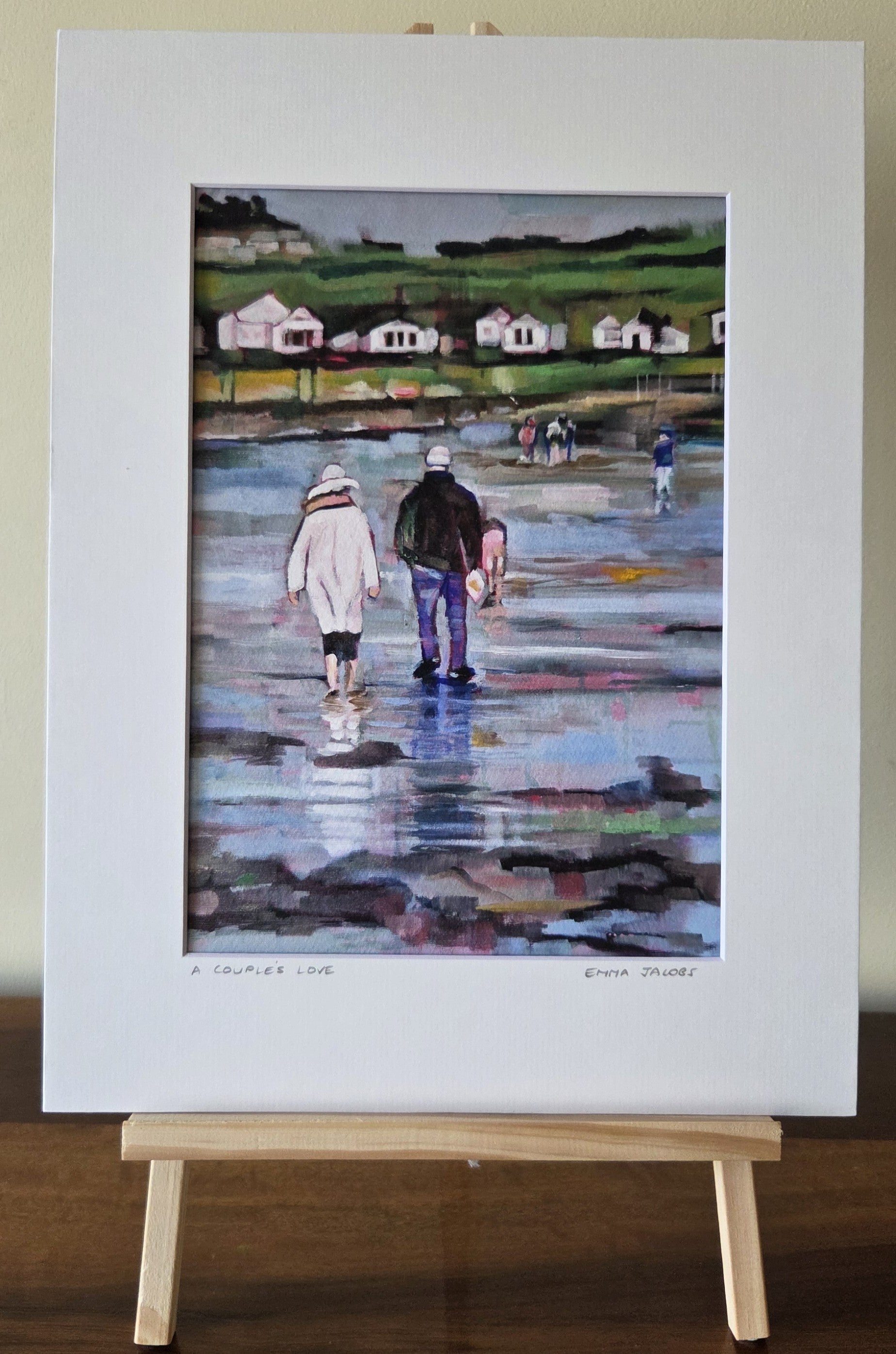 Mounted fine art print of a couple walking on the beach, by Irish artist Emma Jacobs